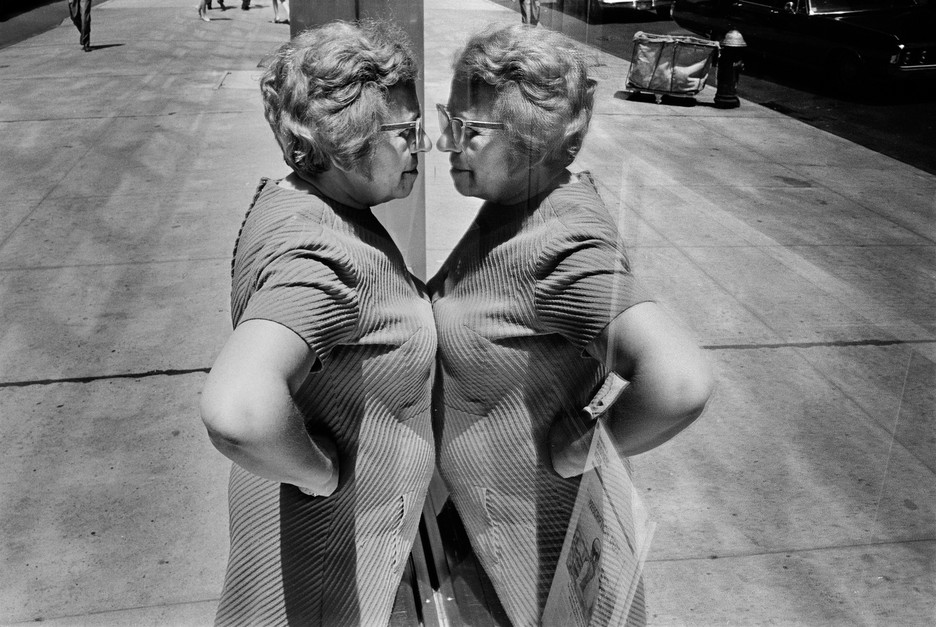 Richard Kalvar: USA. New York City. 1969. Woman looking at herself in store window.